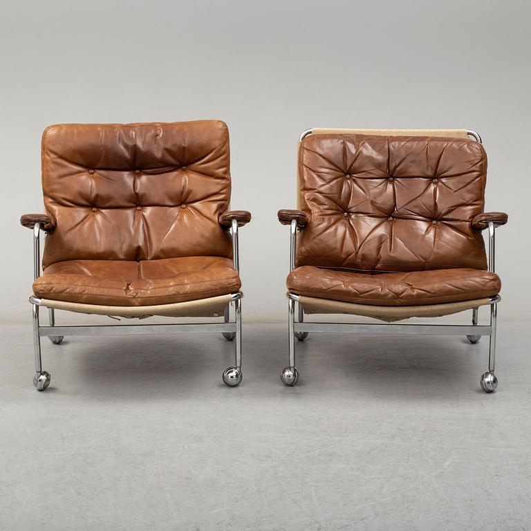 A pair of 'Karin' leather easy chairs by Bruno Mathsson, late 20th Century.