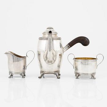 A Swedish Silver Coffee Pot, Creamer and Sugar Bowl, mark of CG Hallberg, Stockholm 1917-18.