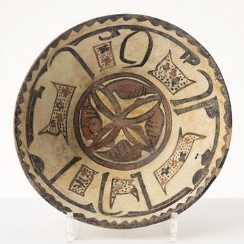 A glazed earthenware bowl, Central Asia.