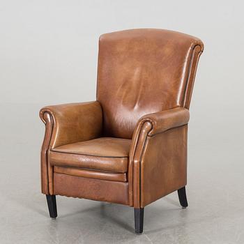 A LEATHER ARMCHAIR.