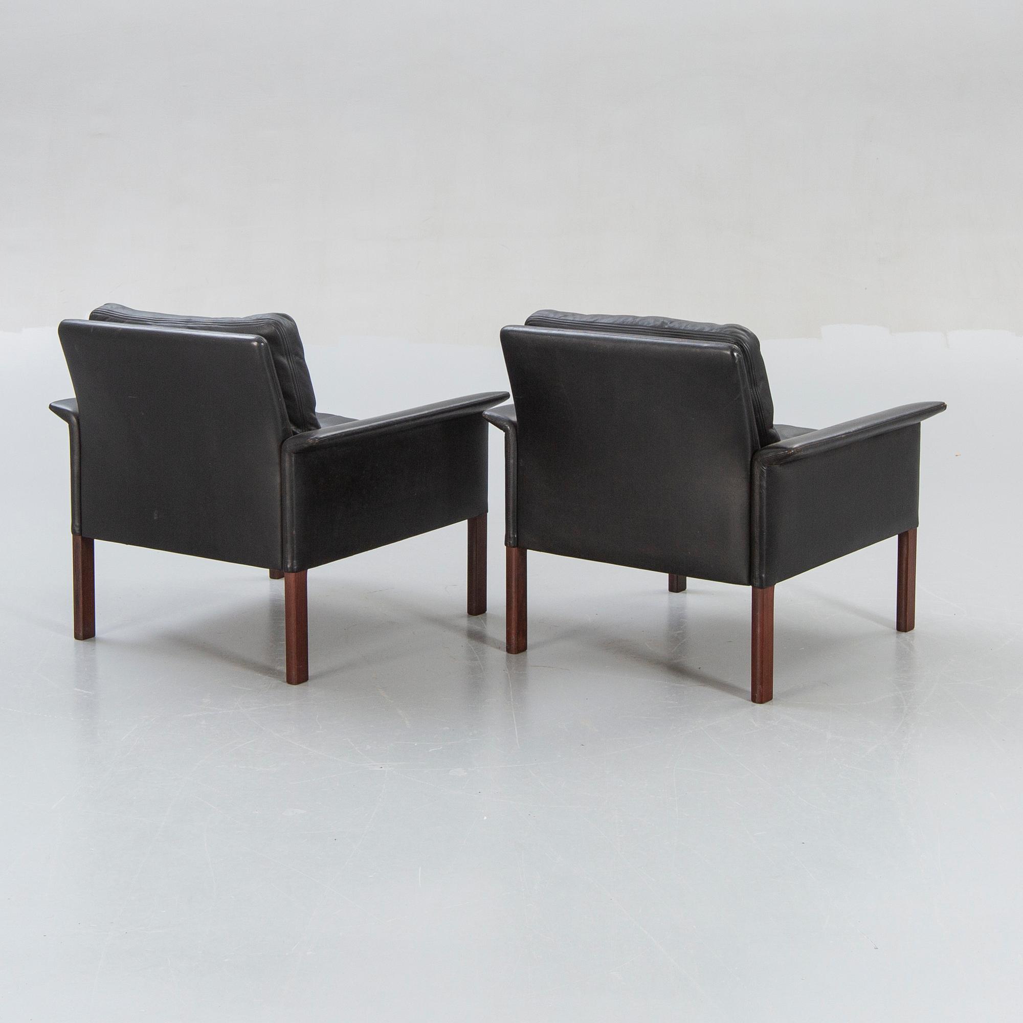 A pair of 1960s leather easy chairs.