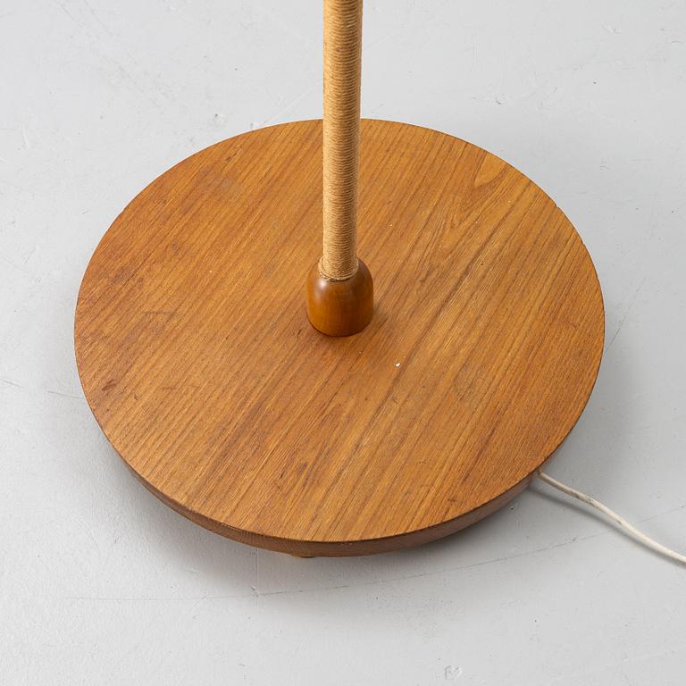 A 1940s Swedish Modern floor lamp.