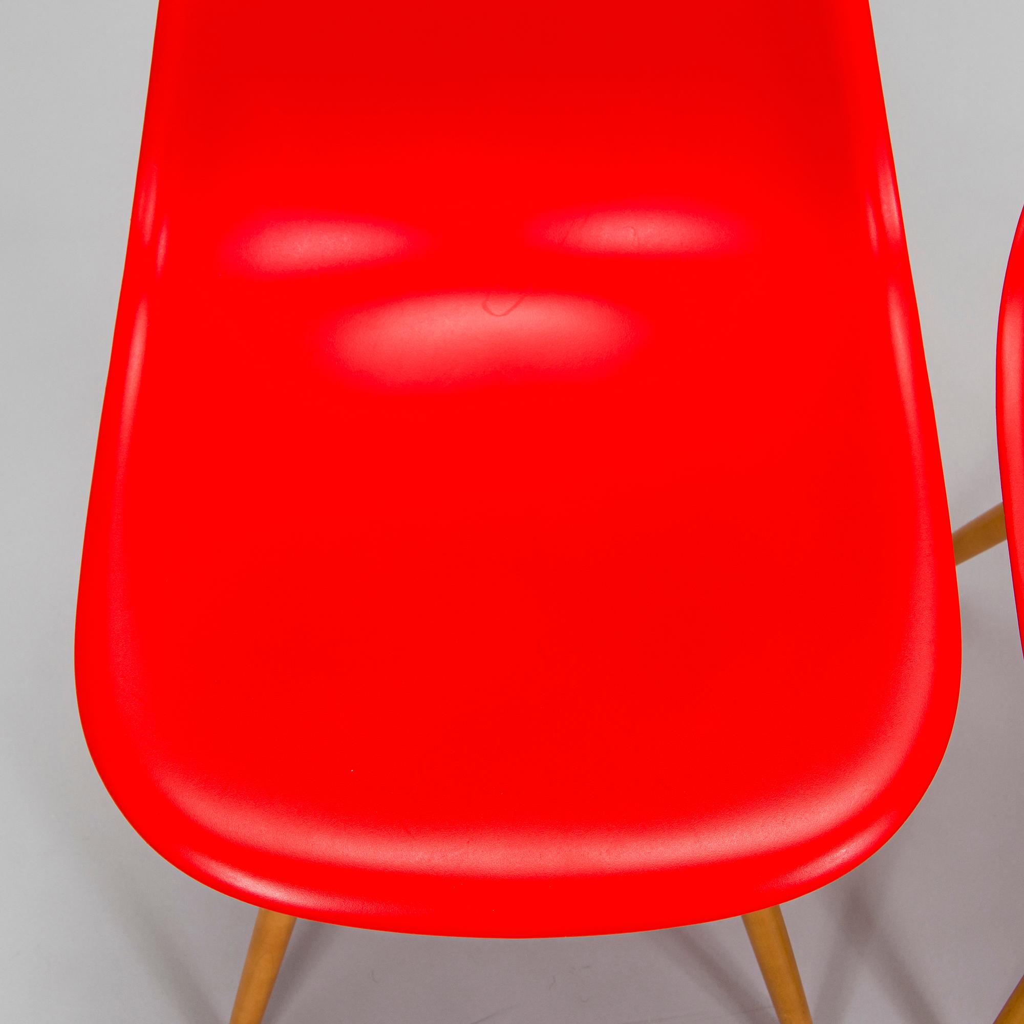 Charles & Ray Eames, two 'Plastic Chair DSW' chairs, Vitra.