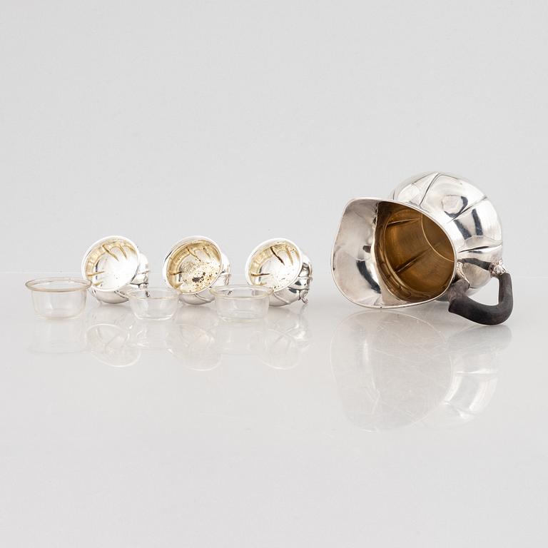 A Danish silver jug and three salt cellars, first half of the 10th Century.