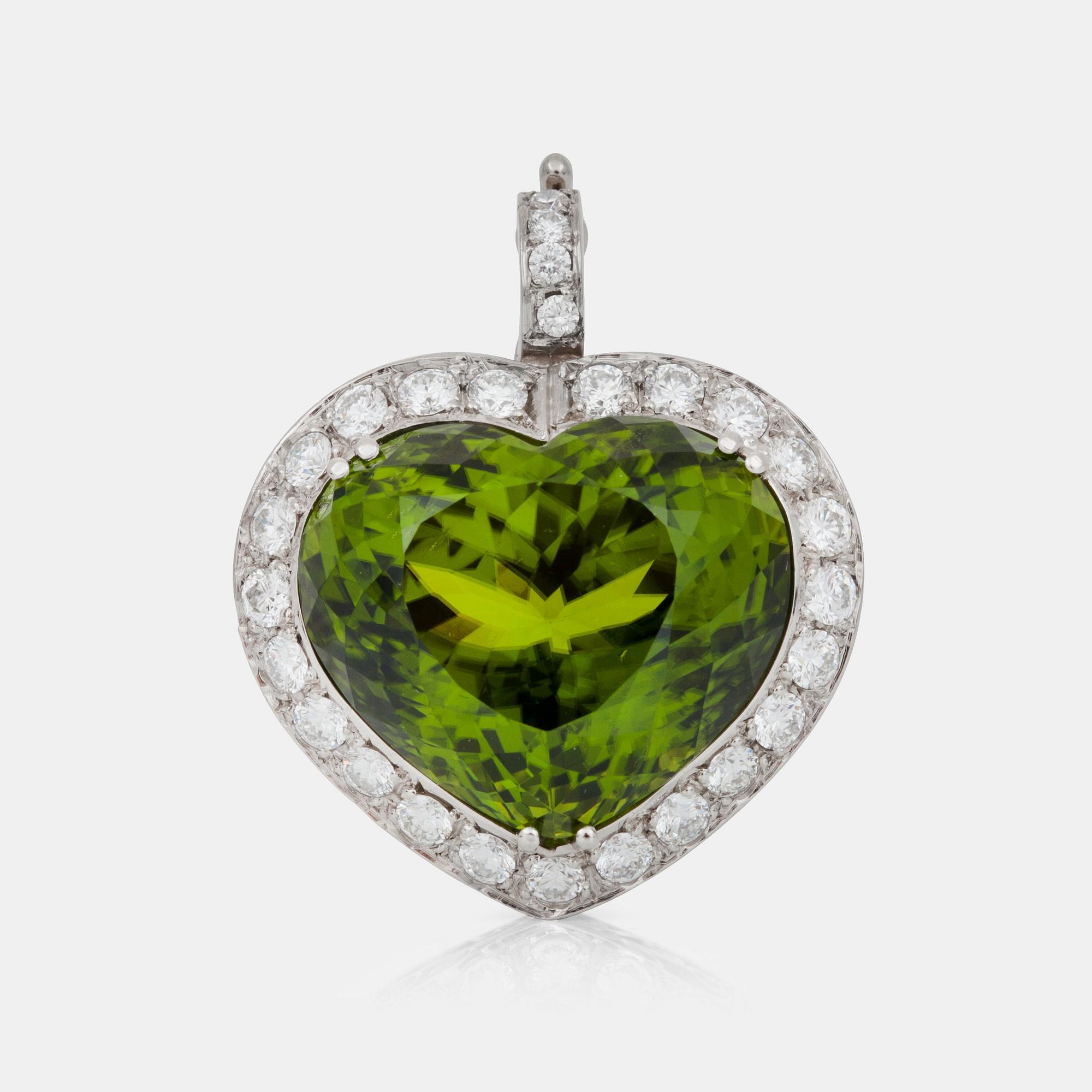 HÄNGE med peridot ca 45.00 ct samt briljantslipade diamanter totalt ca 1.50 ct.