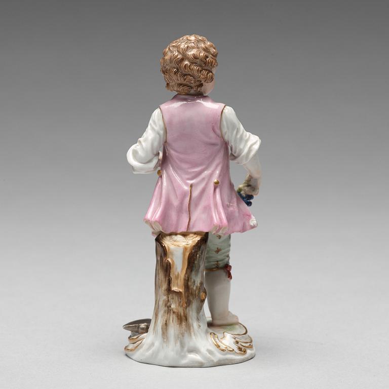 A Meissen figure of a young boy with grapes, 1890's.