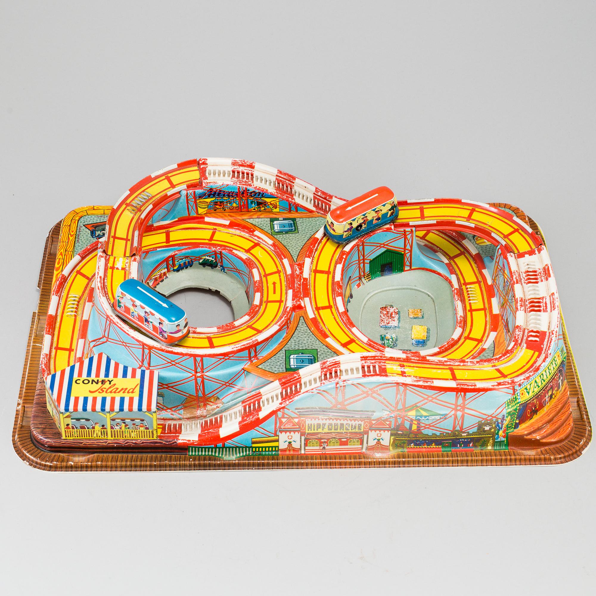 A 1960's  German toy car track with two mechanic buses.