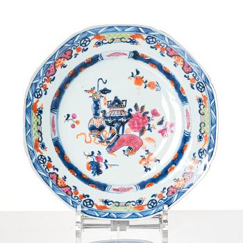 A set of 12 famille rose dinner plates Qing dynasty, Qianlong (1736-95).