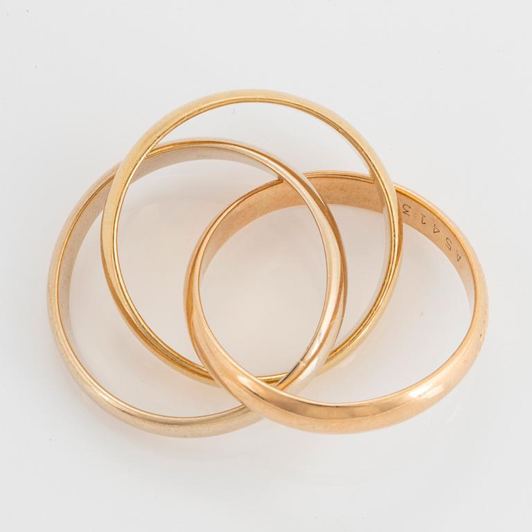 An 18K gold Cartier "Trinity" ring.