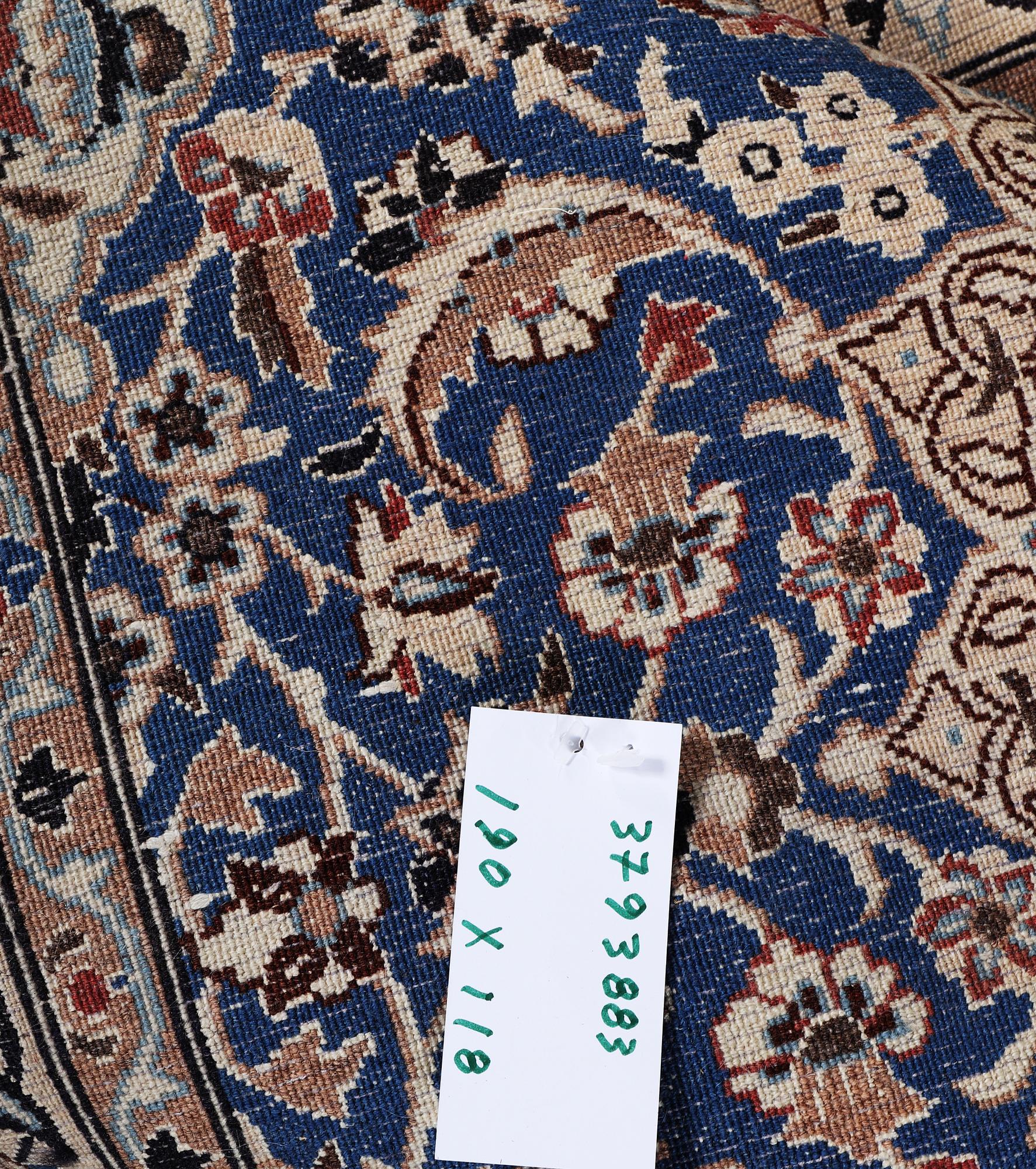 A Nain rug, part silk, 9 laa, c. 190 x 118 cm.