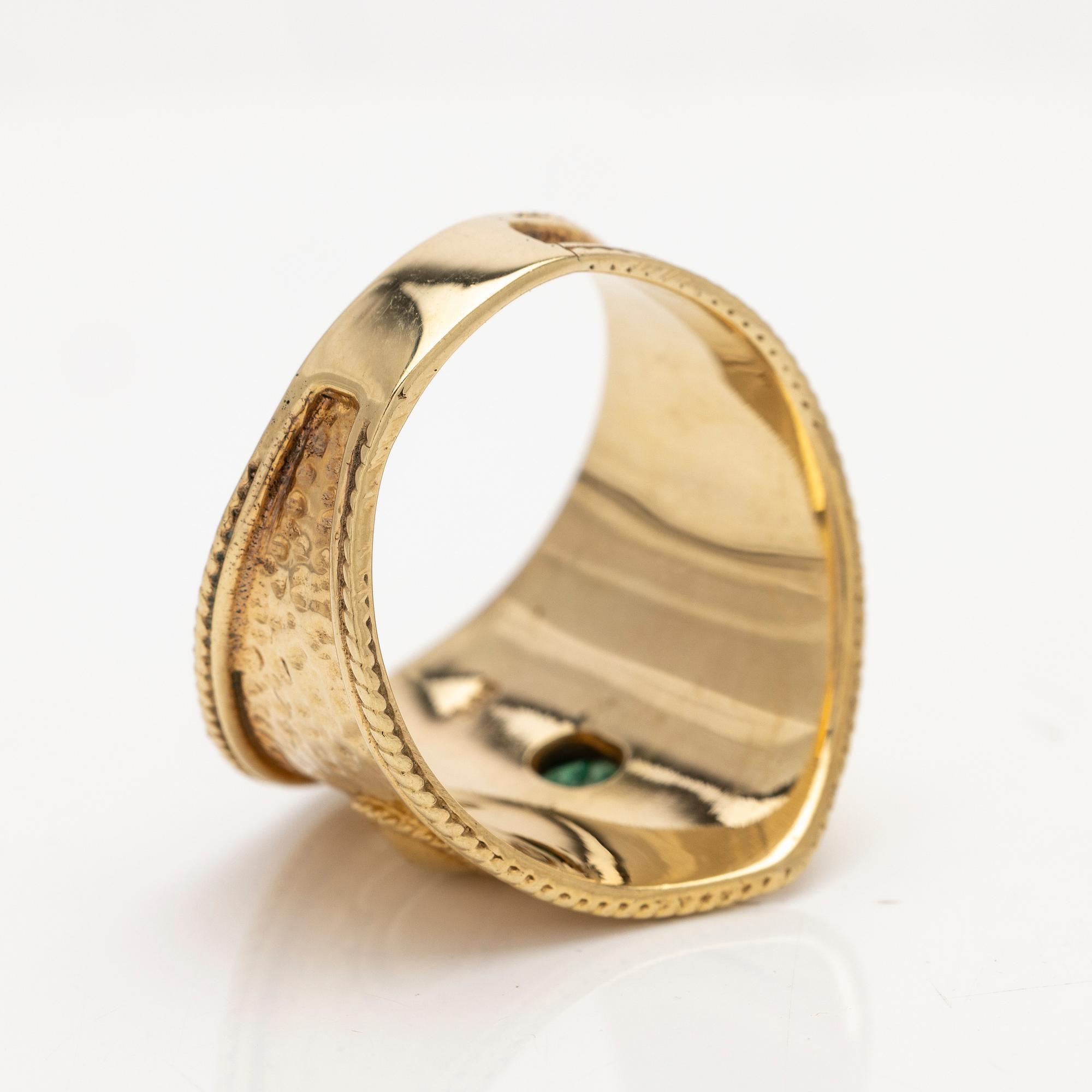 14K gold ring with an emerald.