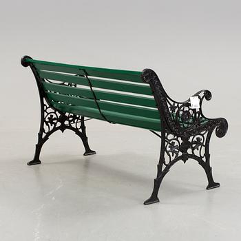 A cast iron framed garden sofa, about 2000.