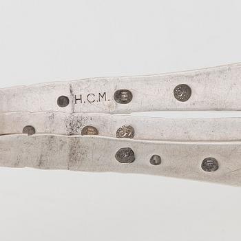 A set of  four silver serving spoons, with a set of 12 coffee spoons, Denmark, early and first half of the 20th century.