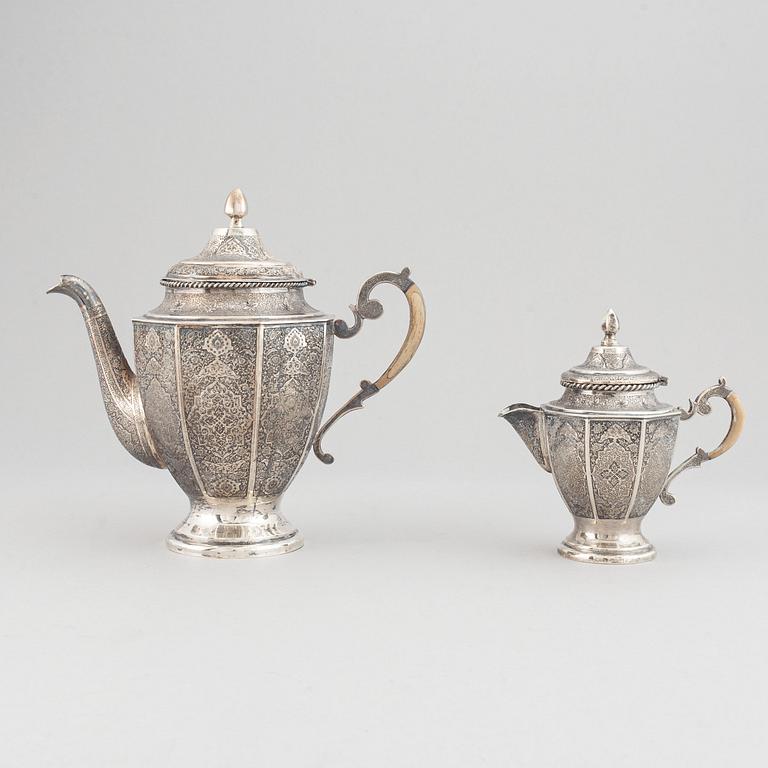 A persian silver coffee-pot and creamer, Iran Isfahan, late Pahlavi dynasty.