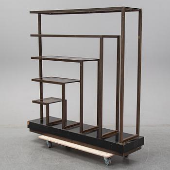 A metall and glass bookcase, late 20th Century.