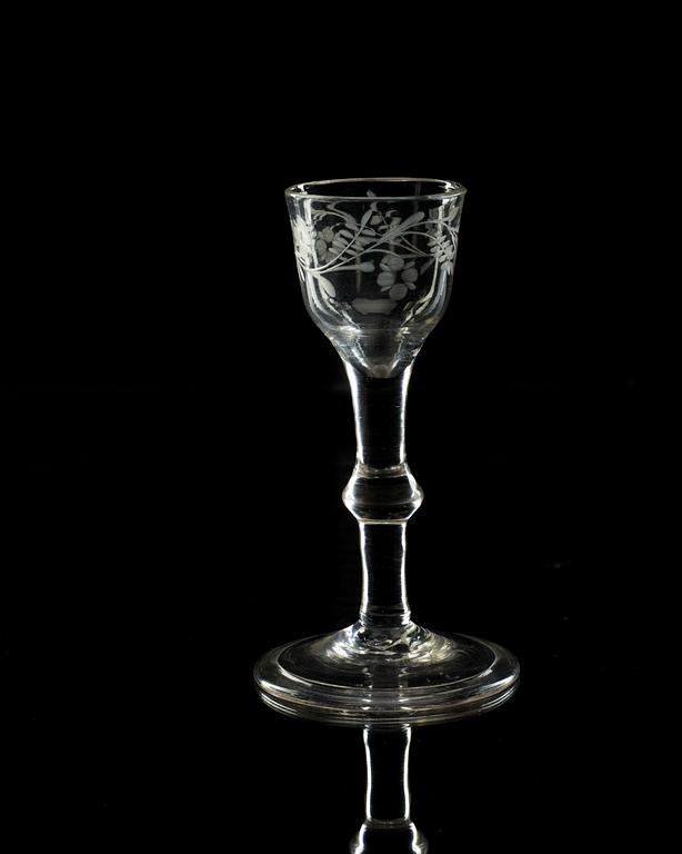 An engraved wine glass, 18th Century, presumably England.