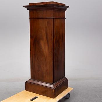 An early 19th Century empire mahogany cabinet.