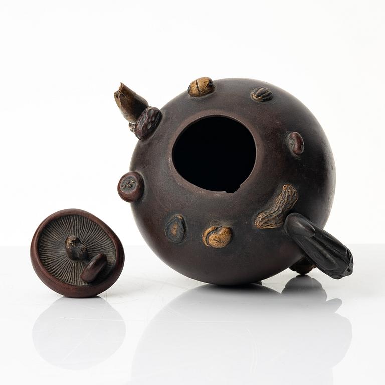 A Chinese 'hundred-fruit' yixing teapot, Qing dynasty (1644-1912).