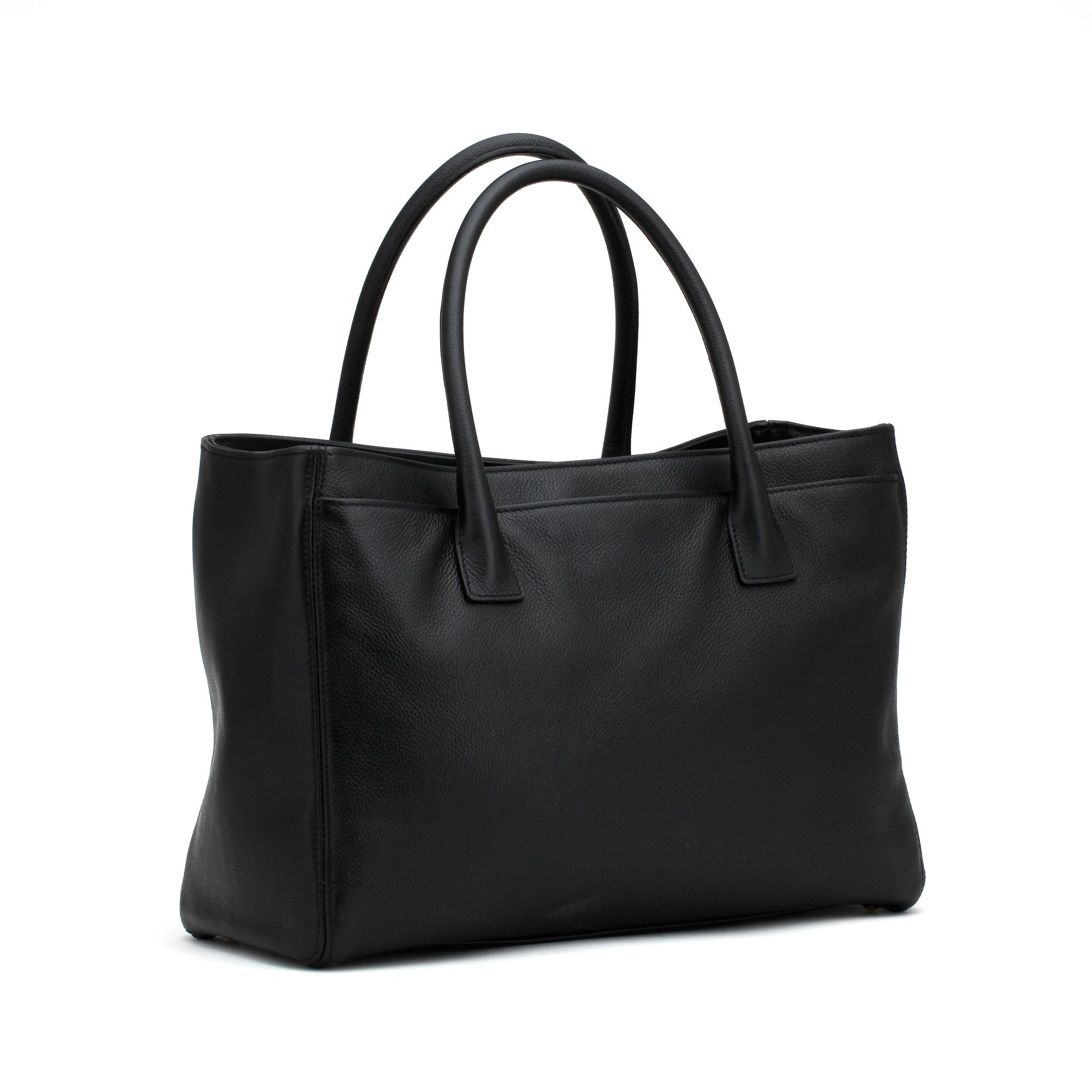 CHANEL,  a black leather bag.