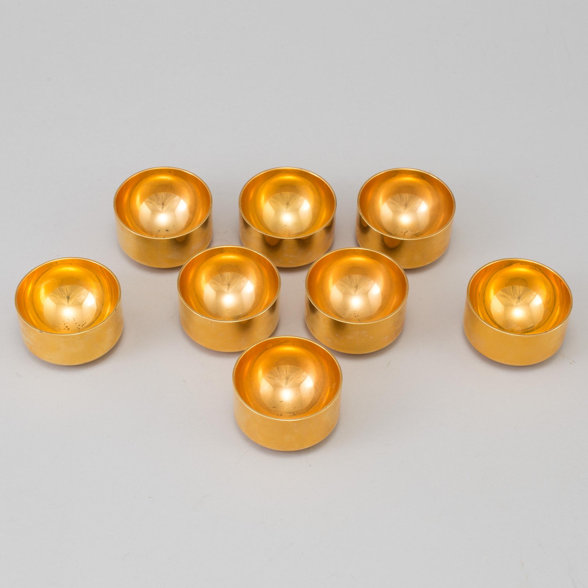A set of eight brass drinking cups by PIERRE FORSSELL for Skultuna, Sweden.