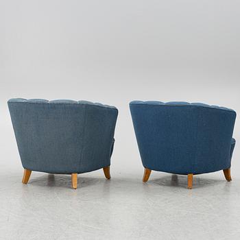 A pair of 1950's armchairs.