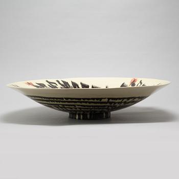 JEAN BESNARD, a glazed ceramic charger, France, signed and dated 1925.