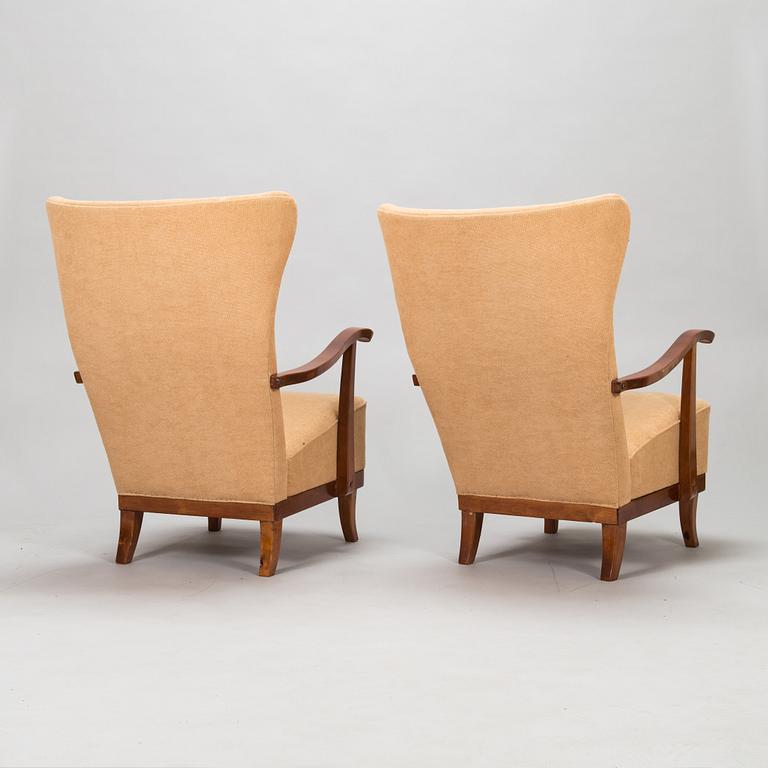 A pair of 1950s armchairs.