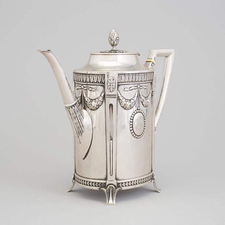 A set of three silver objects (coffeepot, creamer and sugarbowl, CG Hallberg and GAB, Stockholm 1907. Weight ca 1226 gr.