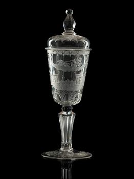 A cut and engraved glass goblet with cover, 18th Century.