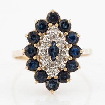 Ring 14K barn-shaped with dark sapphires and small diamonds.