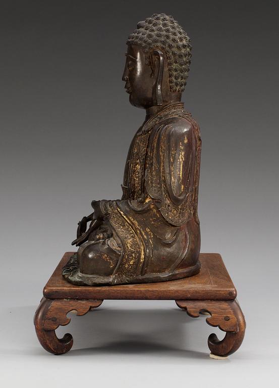 A bronze figure of Buddha, late Ming dynasty (1368-1644).
