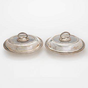 A set of four silver plated entree dishes, England.