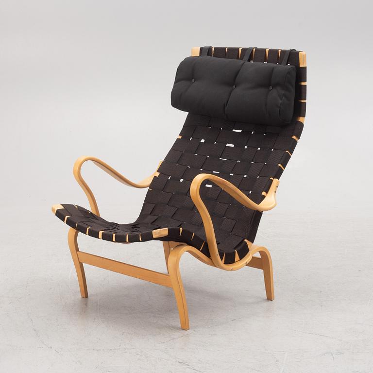 Bruno Mathsson, a "Pernilla" armchairs with ottoman, Dux, Sweden, second half of the 20th century.