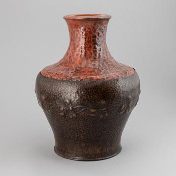 A large earthenware and copper vase, easy 20th century.