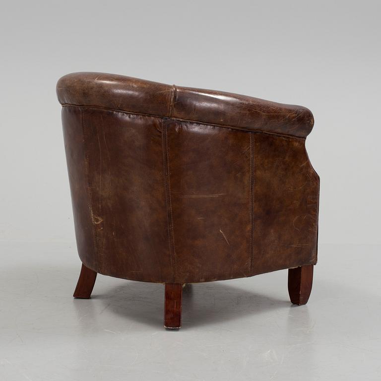 A leather club lounge chair by Newport, ca 2000.