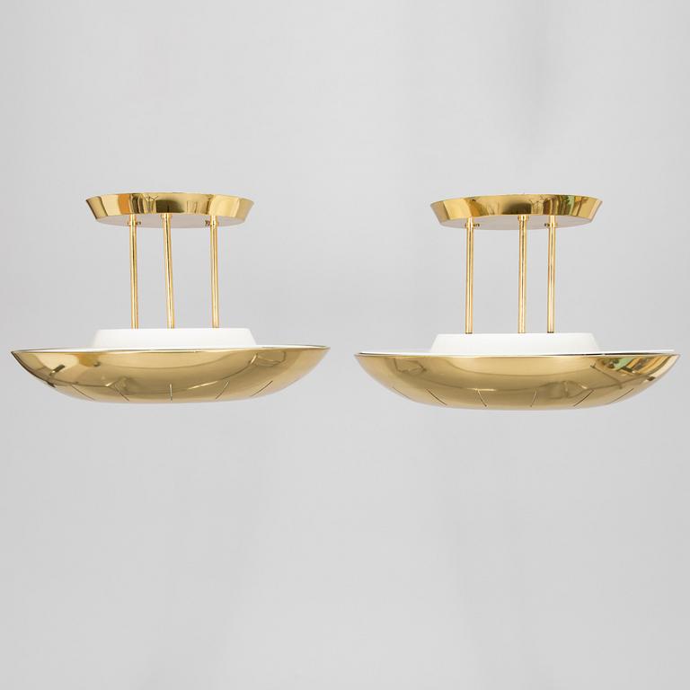 A pair of 1980s brass ceiling lights.