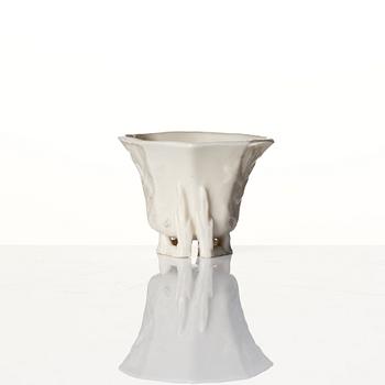 A lacquer tea box and a blanc de chine cup, Qing dynasty 18/19th century.