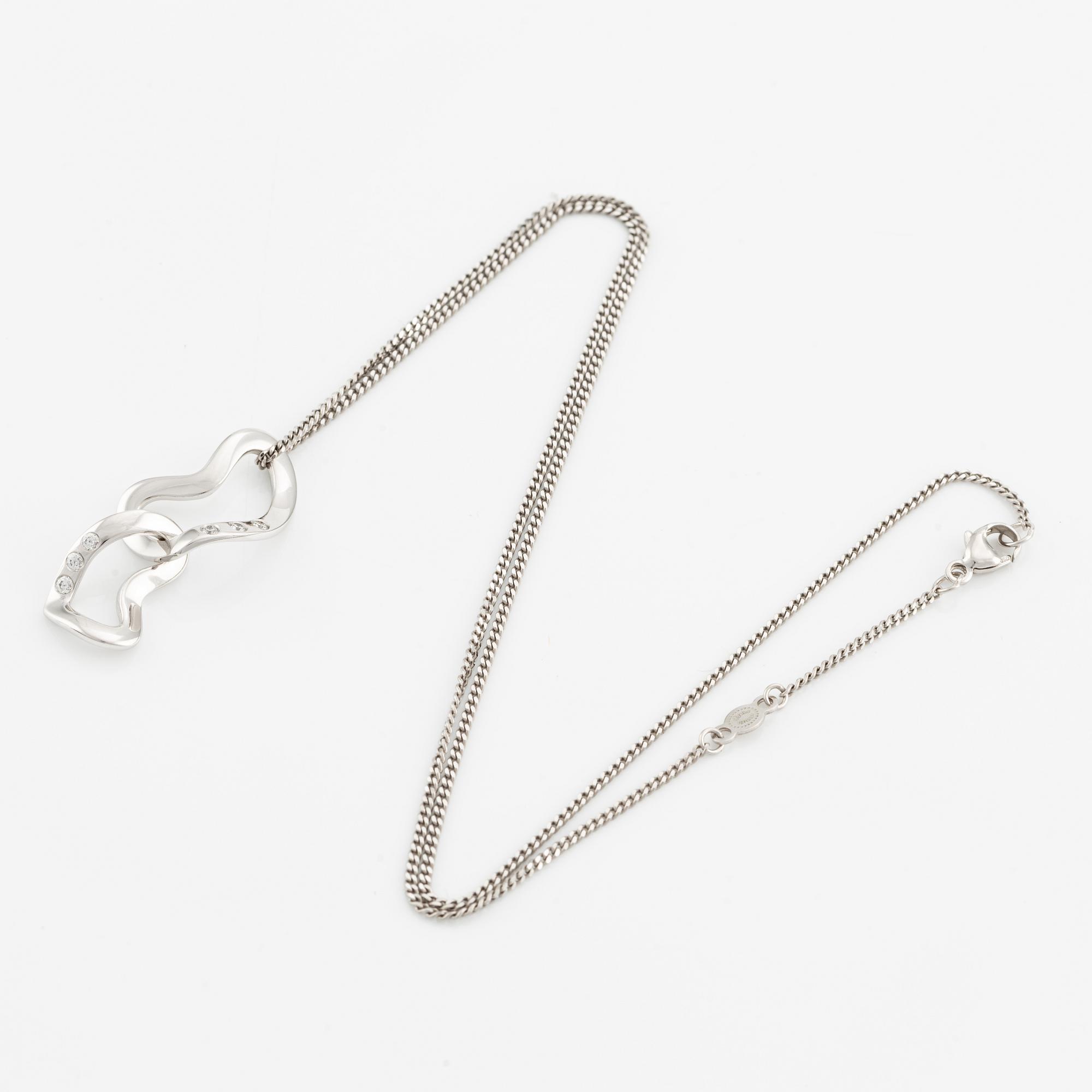 Firma Georg Jensen hänge med kedja 18K vitguld med runda briljantslipade diamanter.
