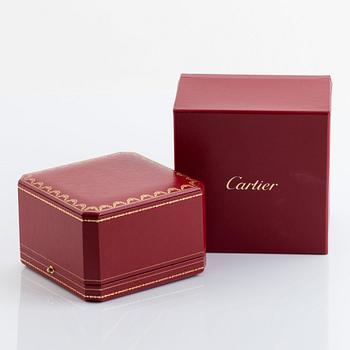 A Cartier "Juste un Clou" bracelet in 18K gold set with round brilliant-cut diamonds.