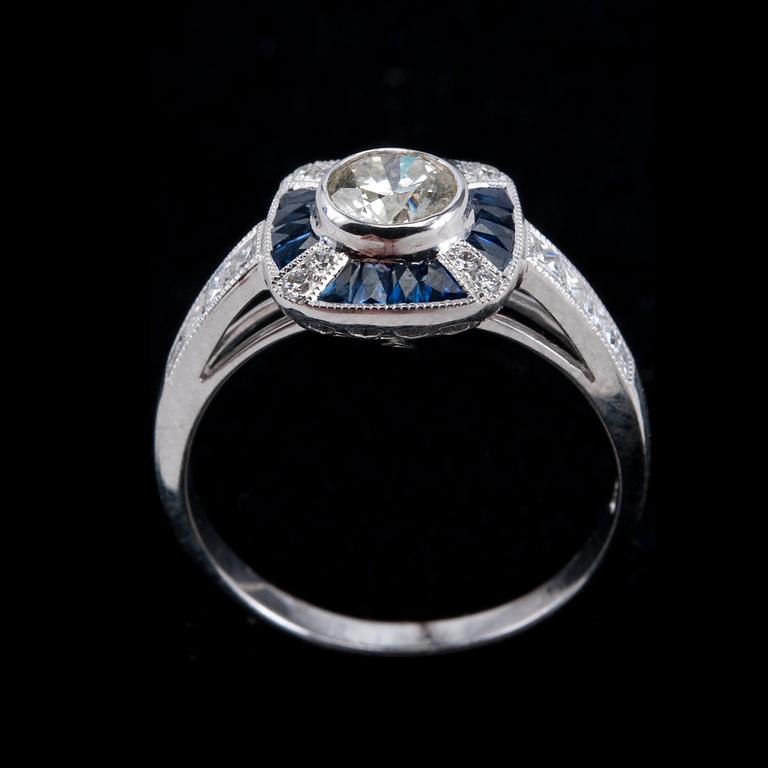 A RING, brilliant cut diamonds 1 x 0.51 ct. and 0.36 ct. Fancy cut sapphires.