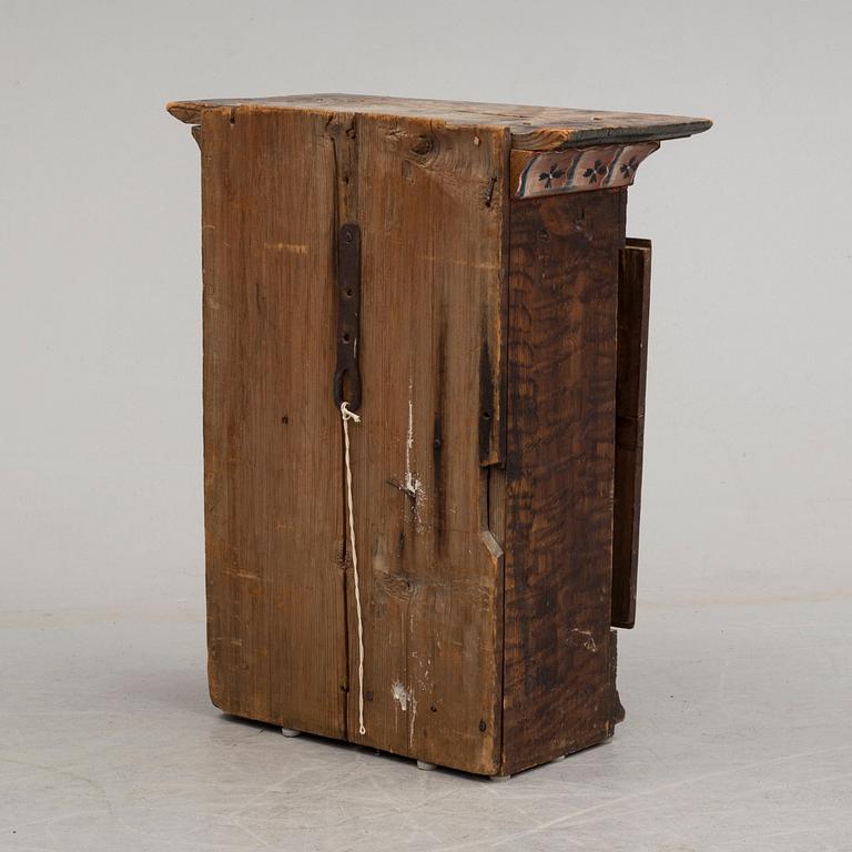 An early 19th century wall cabinet.