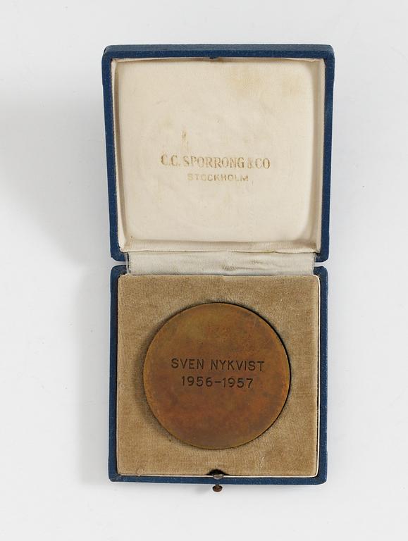 A BRONZE MEDAL,  The Swedish Film Socitey Plaque 1956-57.