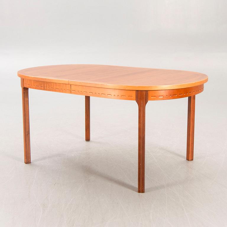 A Nils Jonsson teak and walnut 1960s dining table.