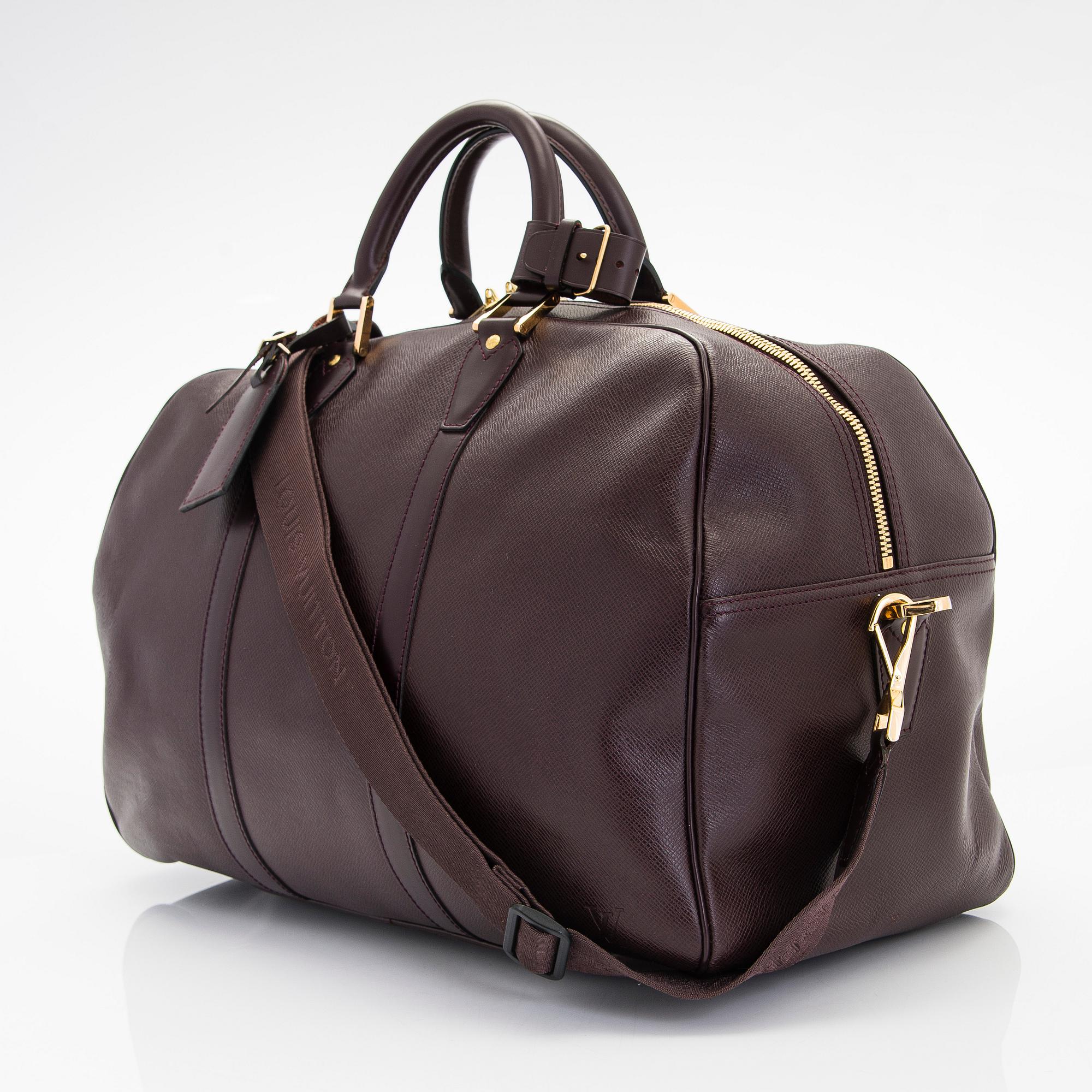 Louis Vuitton, a 'Taiga Kendall PM' weekend bag.