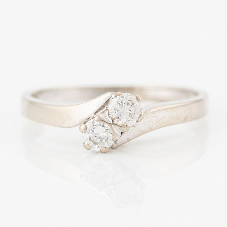 Ring, 18K white gold with two brilliant-cut diamonds.