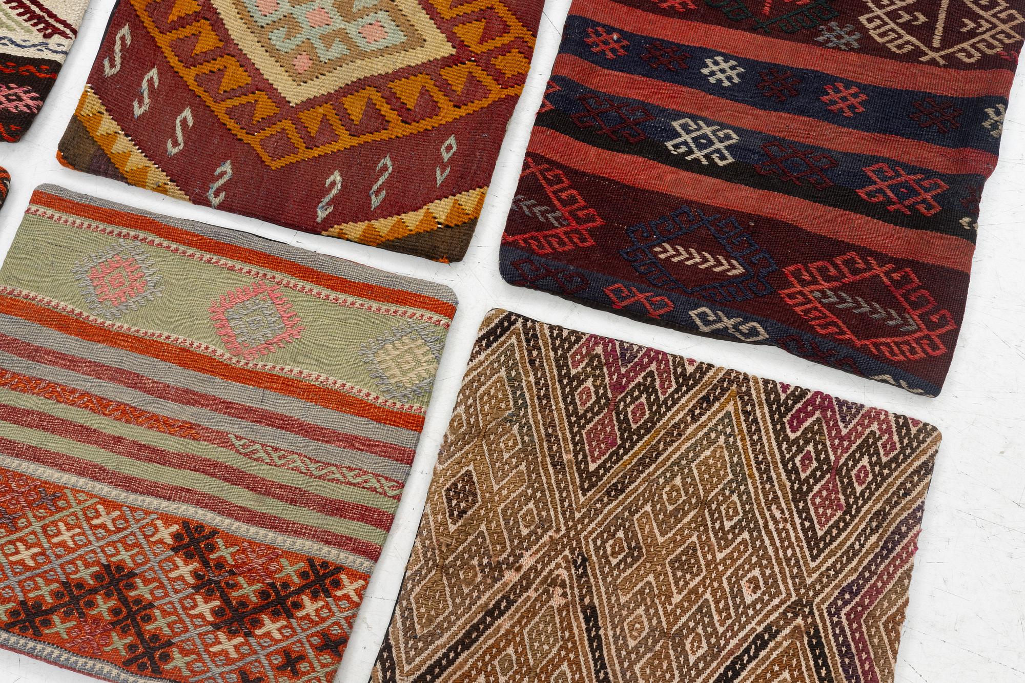 Nine Kilim pillow cases and two Kilim pillows, around 1970, ca. 50 x 50 cm.