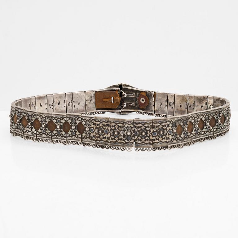 A Caucasian silver and leather belt with niello, early 20th century.