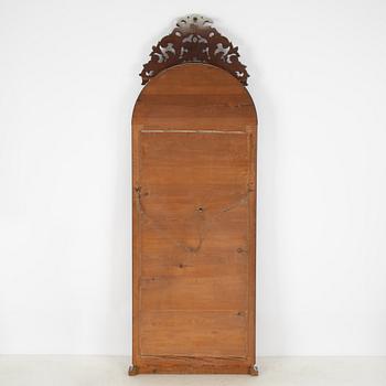 A Rococo revival mirror, late 19th Century.