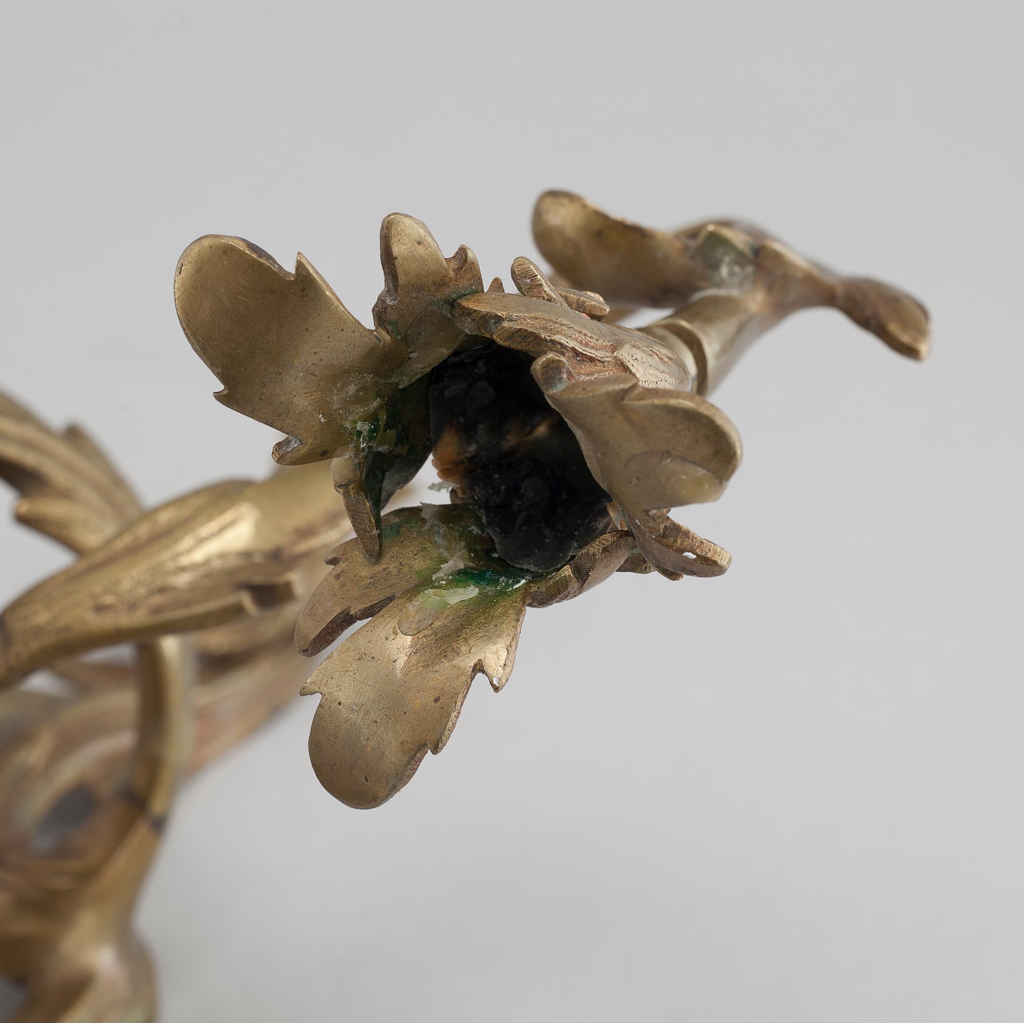 A pair of Louis XV-style brass wall sconces first half of the 20th century.