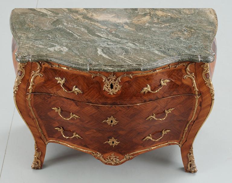 A Swedish Rococo commode attributed to J. J. Eisenbletter.